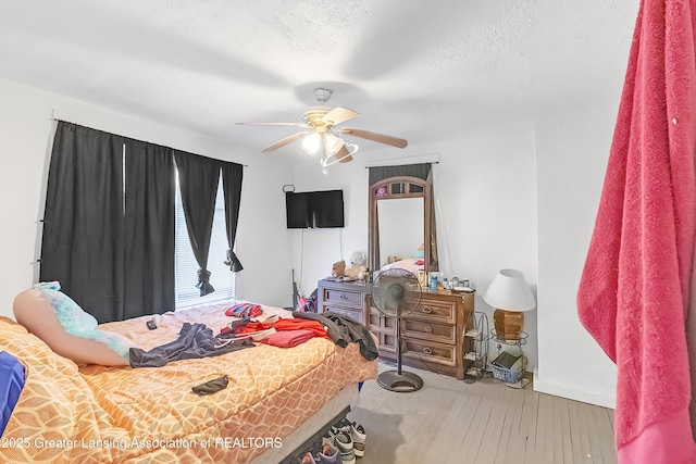 114 Haze St, Lansing, MI 48917 - bedroom featuring wood finished floors, baseboards, and ceiling fan