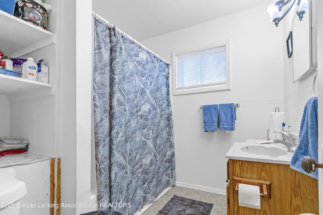 114 Haze St, Lansing, MI 48917 - bathroom featuring a shower with shower curtain, vanity, and baseboards