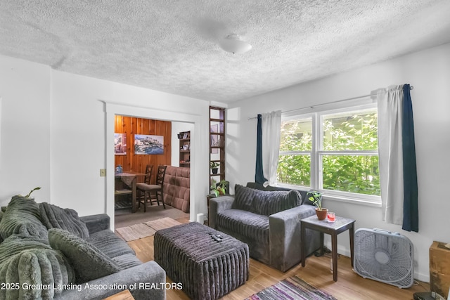 922 Dakin St, Lansing, MI 48912 - living room with wood finished floors and a textured ceiling