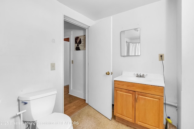 922 Dakin St, Lansing, MI 48912 - bathroom featuring toilet and vanity
