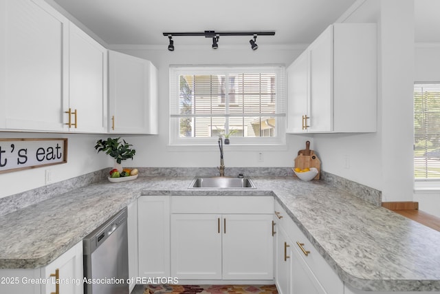 514 W St, Lansing, MI 48915 - kitchen with a sink, dishwasher, and light countertops