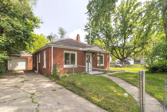 100 Dunlap St, Lansing, MI 48910 - view of front of house featuring concrete driveway, brick siding, an outbuilding, and a chimney