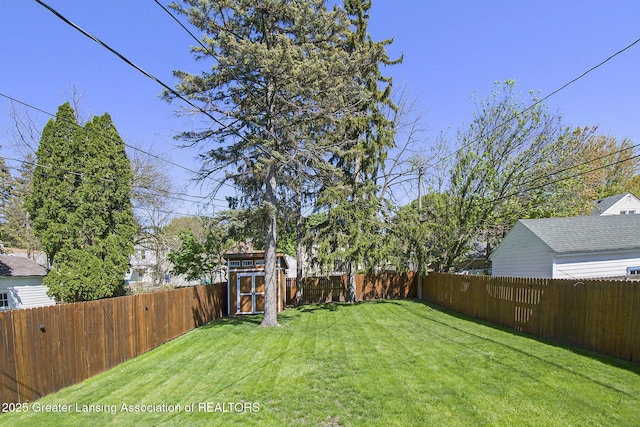 2119 Grant St, Lansing, MI 48910 - view of yard featuring a storage shed and an outbuilding