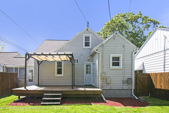 2119 Grant St, Lansing, MI 48910 - rear view of house with fence, a pergola, and a deck