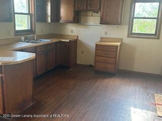kitchen with dark wood finished floors and light countertops