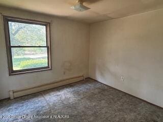 spare room with baseboard heating