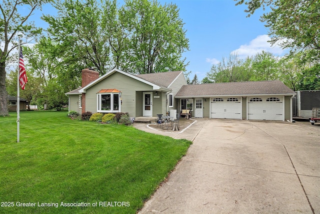 12197 W Greenfield Rd, Lansing, MI 48917 - view of front of home featuring an attached garage, a chimney, driveway, and a front yard