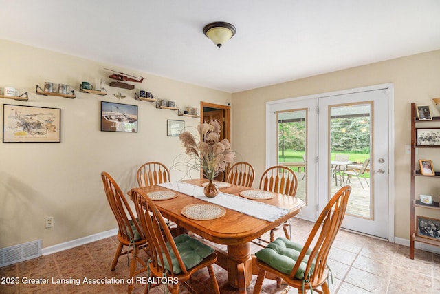 12197 W Greenfield Rd, Lansing, MI 48917 - dining space featuring baseboards