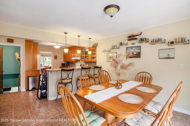 12197 W Greenfield Rd, Lansing, MI 48917 - dining area featuring tile patterned flooring