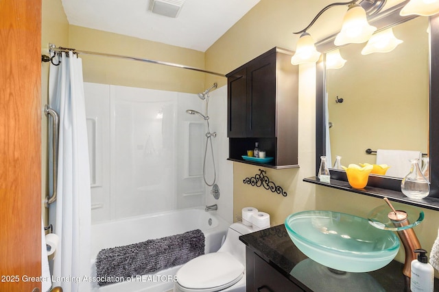 12197 W Greenfield Rd, Lansing, MI 48917 - bathroom with vanity, shower / bath combo with shower curtain, and toilet