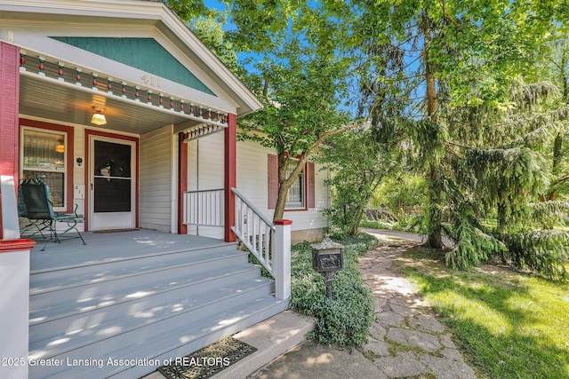 411 Jackson St, Grand Ledge, MI 48837 - entrance to property featuring covered porch