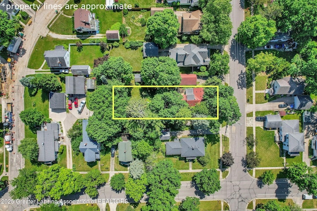 411 Jackson St, Grand Ledge, MI 48837 - aerial view of residential area with property parcel outlined