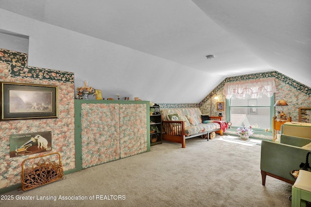 411 Jackson St, Grand Ledge, MI 48837 - living area with vaulted ceiling, carpet, and wallpapered walls
