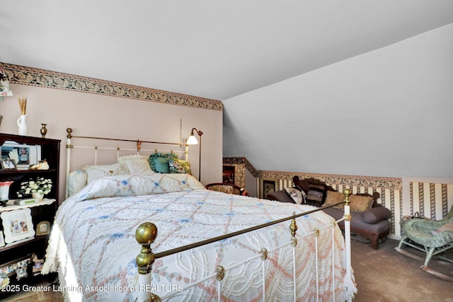 411 Jackson St, Grand Ledge, MI 48837 - carpeted bedroom with lofted ceiling