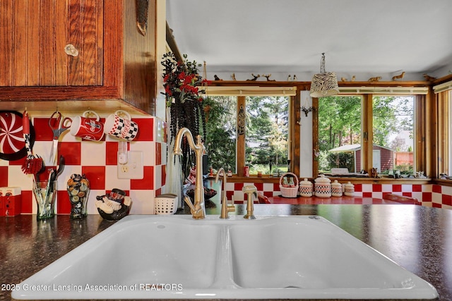 411 Jackson St, Grand Ledge, MI 48837 - kitchen view of a sink and dark countertops