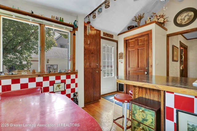 411 Jackson St, Grand Ledge, MI 48837 - dining space with wood finished floors and vaulted ceiling