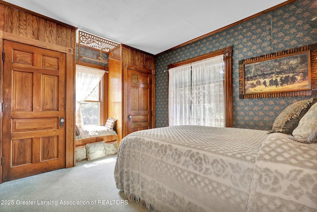 411 Jackson St, Grand Ledge, MI 48837 - carpeted bedroom with multiple windows, wallpapered walls, and ornamental molding