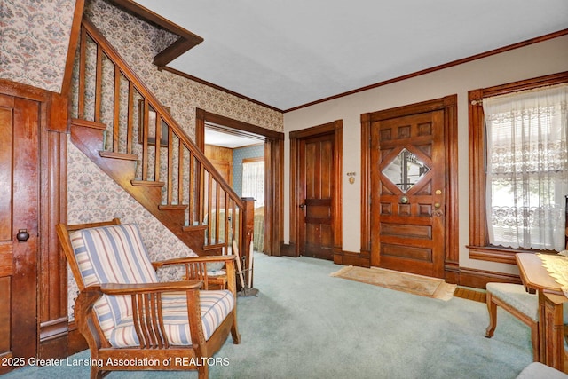 411 Jackson St, Grand Ledge, MI 48837 - foyer featuring stairs, carpet flooring, crown molding, wallpapered walls, and baseboards