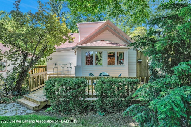 411 Jackson St, Grand Ledge, MI 48837 - view of front of house with a deck