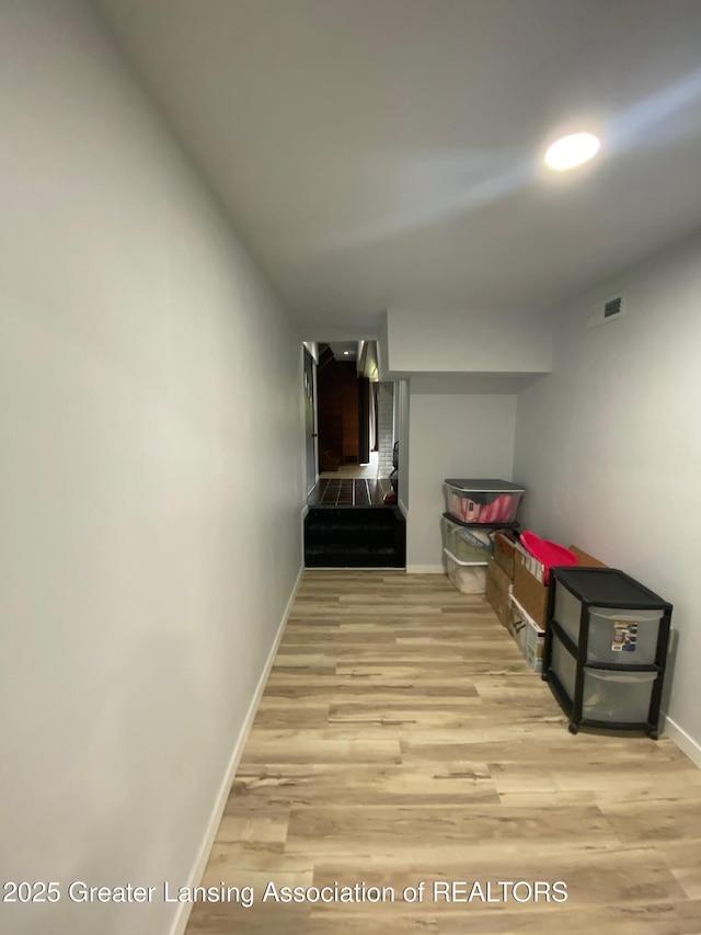 11500 Eden Trl, Eagle, MI 48822 - hallway featuring baseboards and wood finished floors