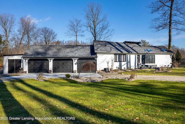 11500 Eden Trl, Eagle, MI 48822 - view of front of property featuring driveway, a front lawn, and a garage