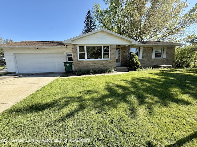 201 W Cavanaugh Rd, Lansing, MI 48910 - single story home with a garage, brick siding, a front lawn, and driveway