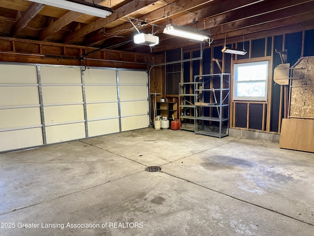 201 W Cavanaugh Rd, Lansing, MI 48910 - garage featuring a garage door opener