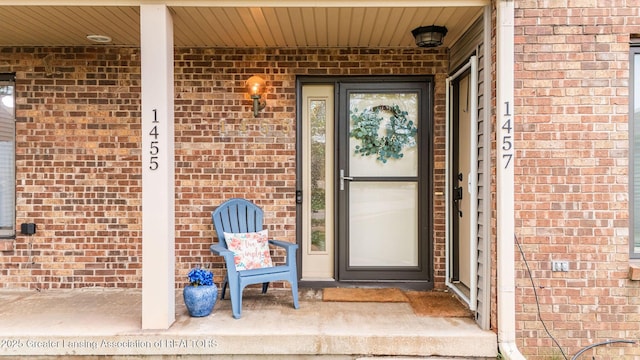 1455 Lakeside Dr, East Lansing, MI 48823 - view of exterior entry featuring brick siding and covered porch