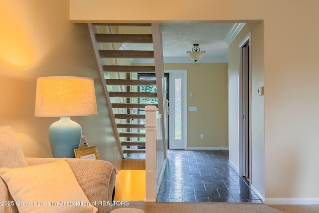 1455 Lakeside Dr, East Lansing, MI 48823 - hallway featuring crown molding, baseboards, and stone tile floors
