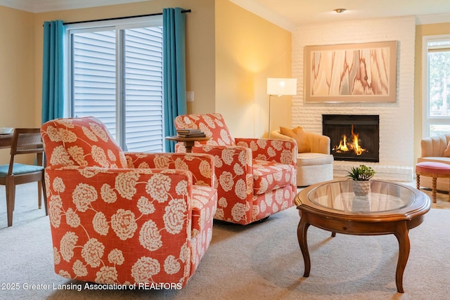 1455 Lakeside Dr, East Lansing, MI 48823 - living room featuring carpet floors, ornamental molding, and a brick fireplace