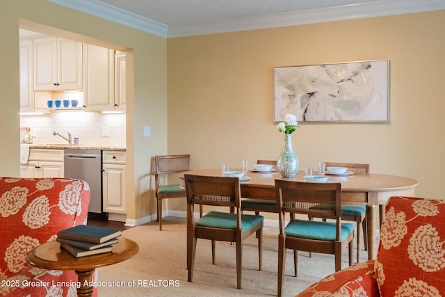 1455 Lakeside Dr, East Lansing, MI 48823 - dining room featuring ornamental molding, light colored carpet, and baseboards