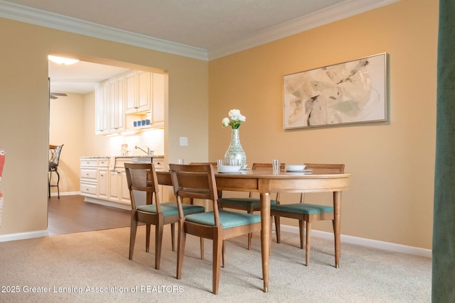 1455 Lakeside Dr, East Lansing, MI 48823 - dining room with light colored carpet, ornamental molding, and baseboards