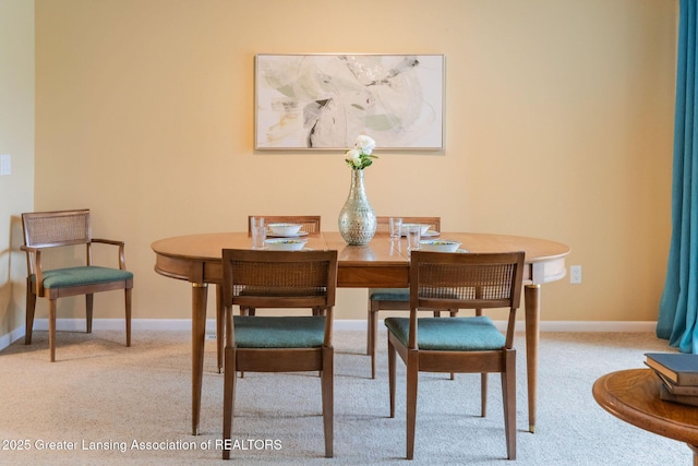 1455 Lakeside Dr, East Lansing, MI 48823 - dining room featuring carpet flooring and baseboards