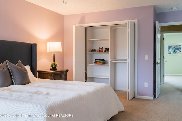 1455 Lakeside Dr, East Lansing, MI 48823 - carpeted bedroom with a closet and baseboards