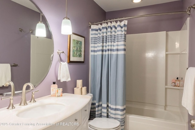 1455 Lakeside Dr, East Lansing, MI 48823 - full bathroom with toilet, shower / tub combo with curtain, and vanity