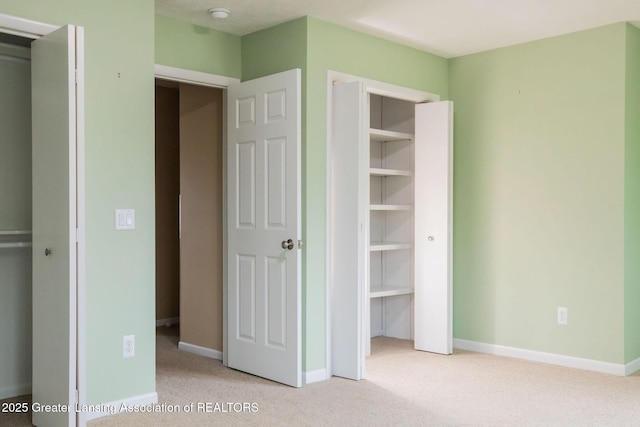 1455 Lakeside Dr, East Lansing, MI 48823 - unfurnished bedroom featuring carpet floors and baseboards