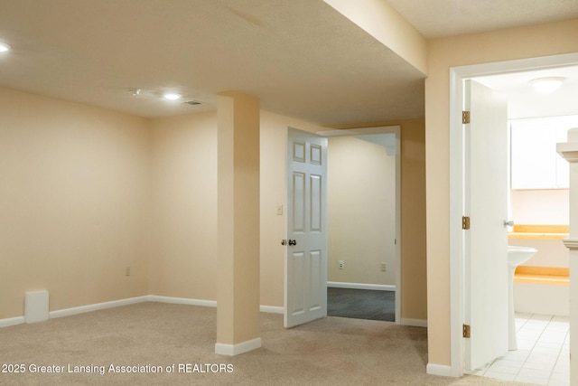 1455 Lakeside Dr, East Lansing, MI 48823 - finished basement with light colored carpet, baseboards, and recessed lighting
