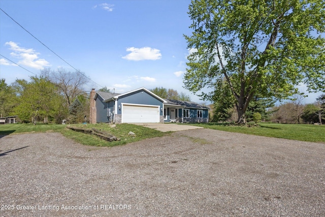 15426 S Lowell Rd, Lansing, MI 48906 - ranch-style house featuring dirt driveway, an attached garage, a front lawn, and a chimney