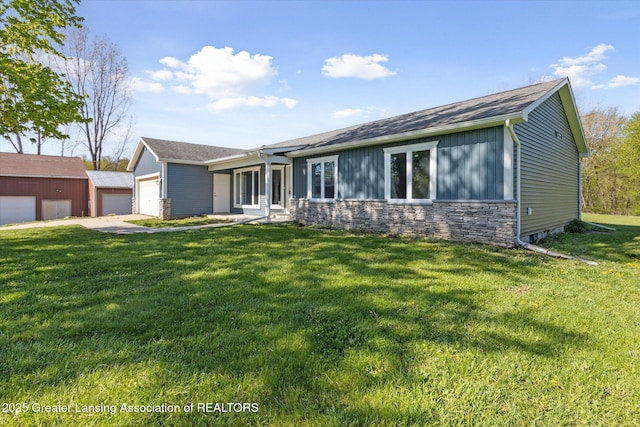 15426 S Lowell Rd, Lansing, MI 48906 - ranch-style home with a front yard, board and batten siding, and roof with shingles