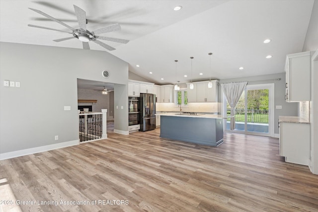 15426 S Lowell Rd, Lansing, MI 48906 - kitchen with fridge with ice dispenser, ceiling fan, white cabinets, light countertops, and recessed lighting