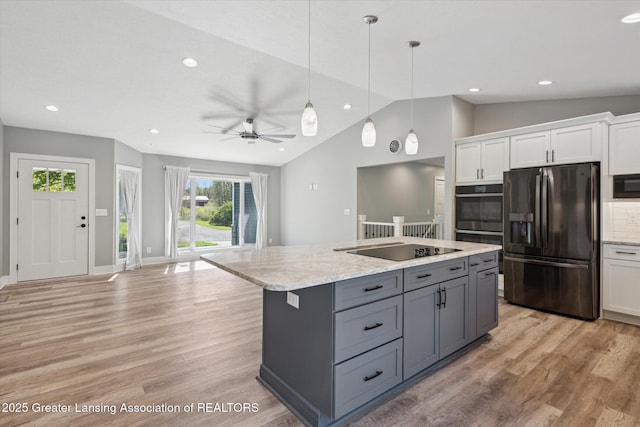 15426 S Lowell Rd, Lansing, MI 48906 - kitchen featuring black appliances, lofted ceiling, white cabinets, gray cabinets, and light wood-style flooring