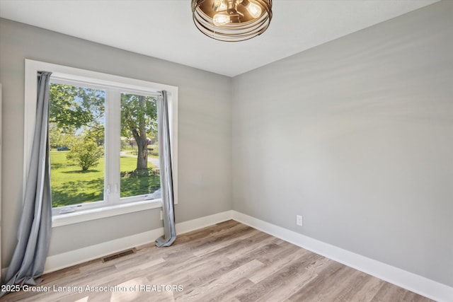15426 S Lowell Rd, Lansing, MI 48906 - unfurnished room featuring light wood-style floors and baseboards