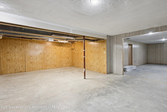 15426 S Lowell Rd, Lansing, MI 48906 - finished below grade area with a textured ceiling and wood walls
