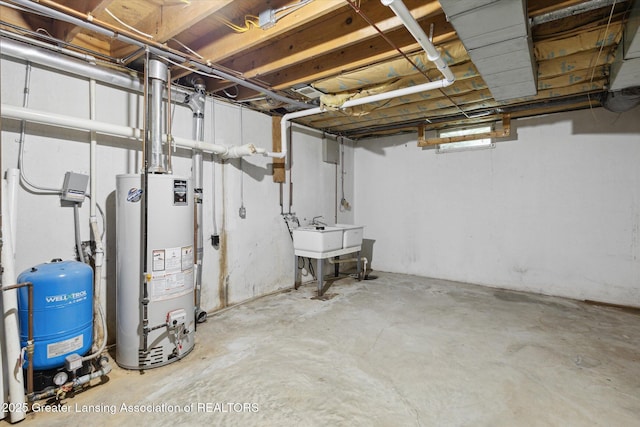 15426 S Lowell Rd, Lansing, MI 48906 - basement featuring water heater, a water pressure tank, and a sink