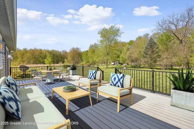 15426 S Lowell Rd, Lansing, MI 48906 - wooden deck with an outdoor hangout area, a yard, outdoor dining area, and view of scattered trees
