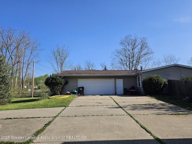 6815 Aurelius Rd, Lansing, MI 48911 - view of front of home featuring an attached garage and concrete driveway
