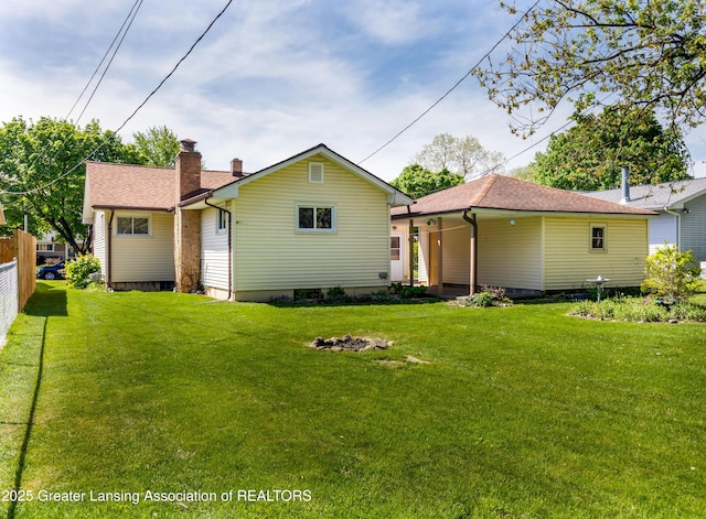 3316 Pickwick Pl, Lansing, MI 48917 - back of property with a chimney and a shingled roof