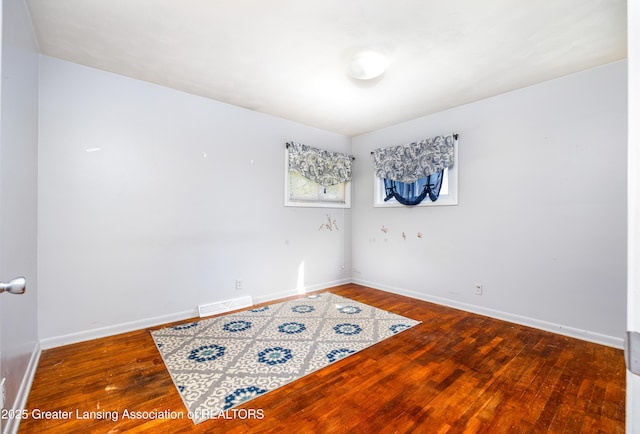 3316 Pickwick Pl, Lansing, MI 48917 - empty room with wood finished floors and baseboards