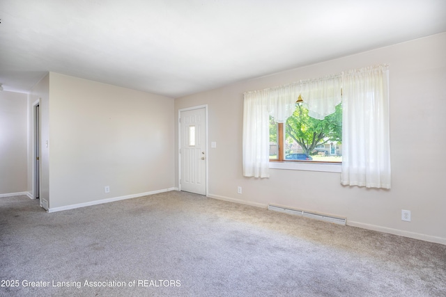 3316 Pickwick Pl, Lansing, MI 48917 - unfurnished living room featuring baseboard heating, carpet floors, and baseboards