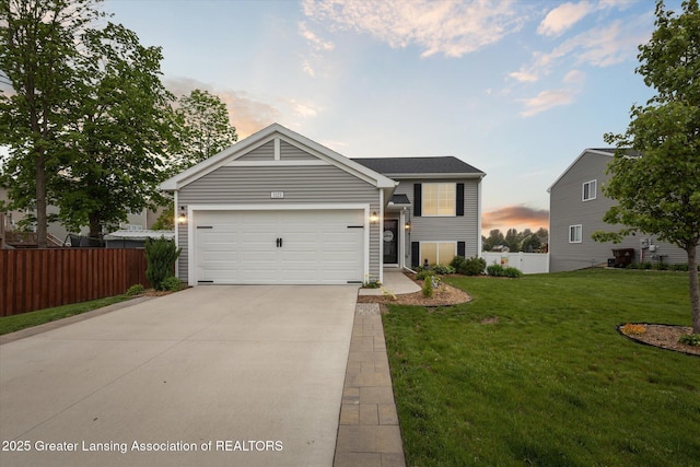 1123 Chesham Ln, Grand Ledge, MI 48837 - view of front of house featuring driveway and a garage